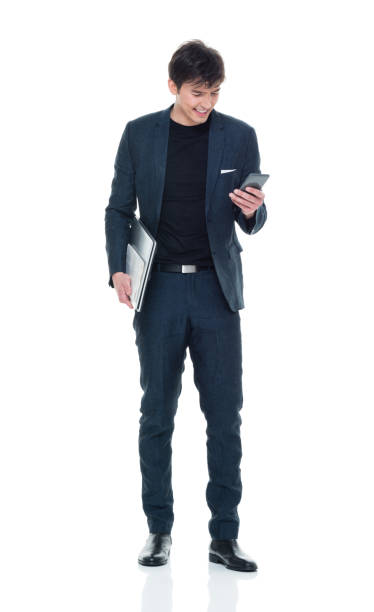 istock Charming young businessman holding phone and laptop 927274064