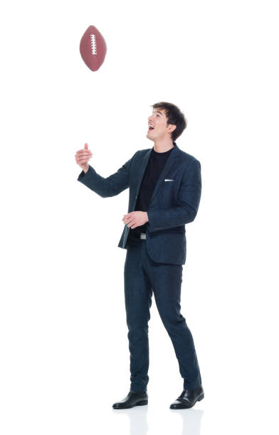 istock Charming young businessman holding a football 927282930