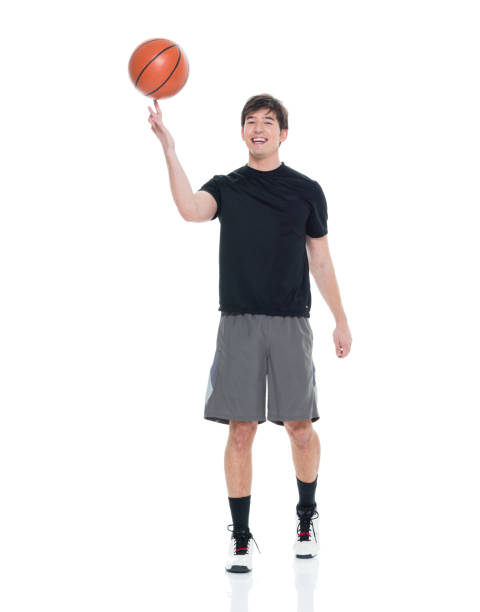 istock Handsome young man spinning a basketball 927282960