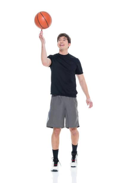 istock Handsome young man spinning a basketball 927283066
