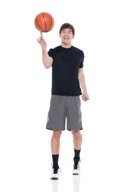 istock Handsome young man spinning a basketball 927283142