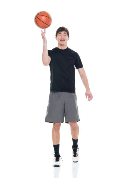 istock Handsome young man spinning a basketball 927283192