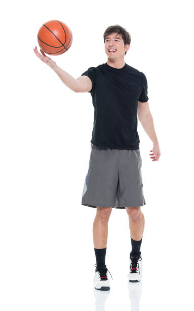 istock Handsome young man spinning a basketball 927283194