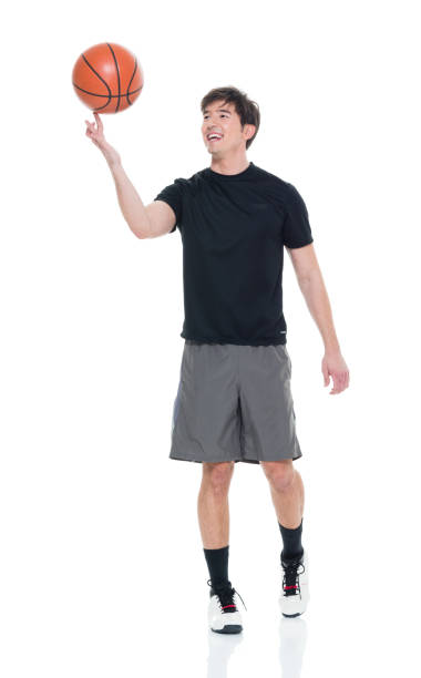 istock Handsome young man spinning a basketball 927283330