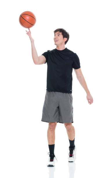 istock Handsome young man spinning a basketball 927283372