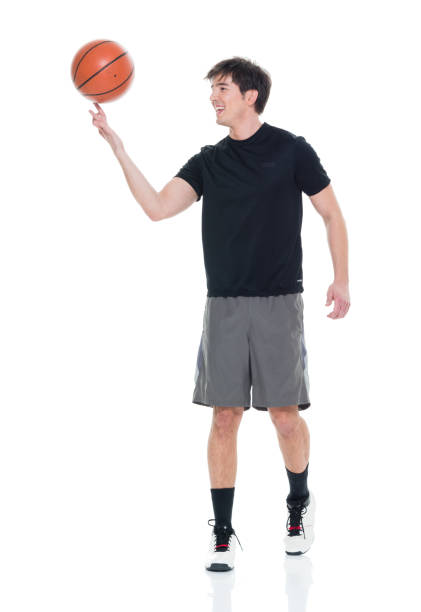istock Handsome young man spinning a basketball 927283398