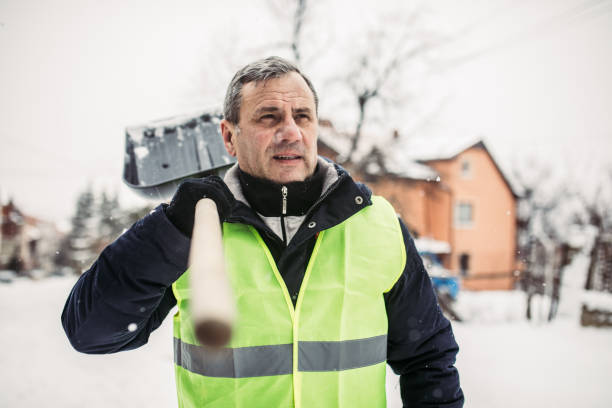 istock Man shoveling and removing snow in winter 927283822