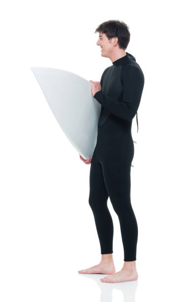 istock Handsome young male surfer 927283920