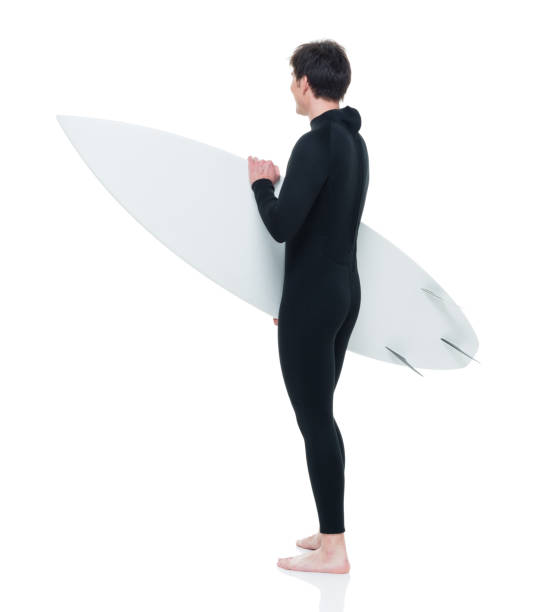 istock Handsome young male surfer 927283944