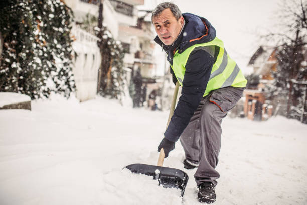 istock Senior man cleaning sidewalk from snow 927283990