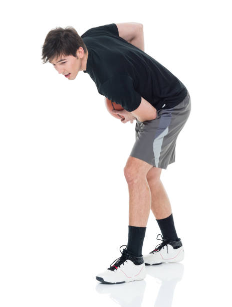 istock Good looking young man playing with a basketball 927284230