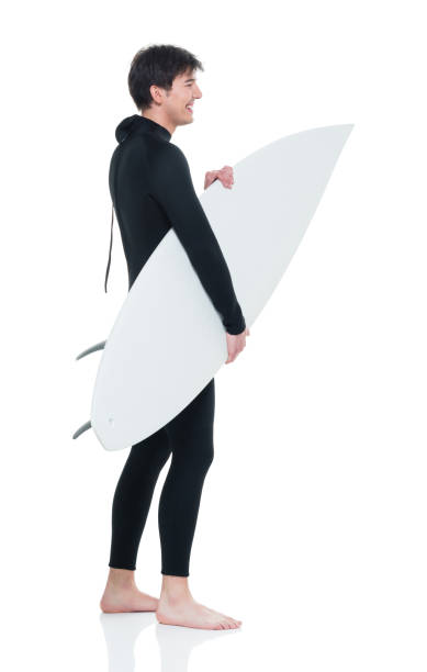 istock Handsome young male surfer 927286510
