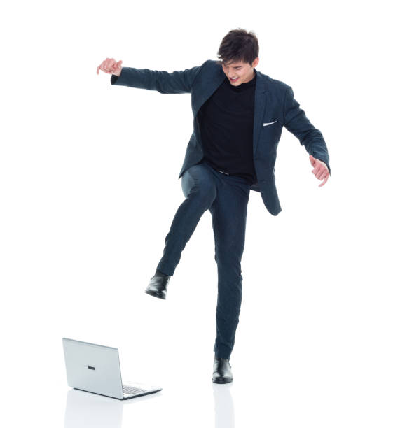 istock Attractive man in business clothes has computer rage 927286964