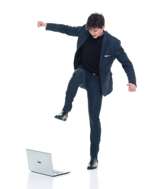 istock Attractive man in business clothes has computer rage 927287024