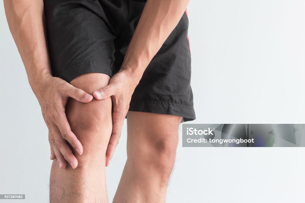 young man with knee pain and copy space Knee Stock Photo
