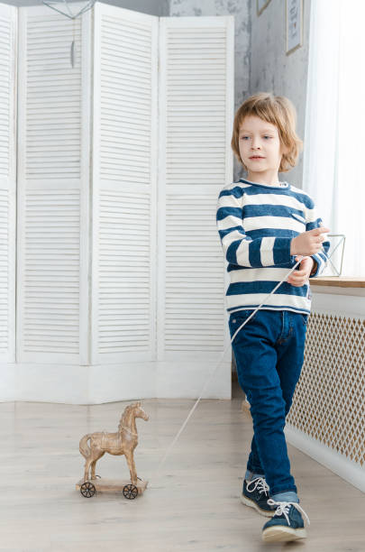 istock boy in stylish clothes posing in the Studio 927289876