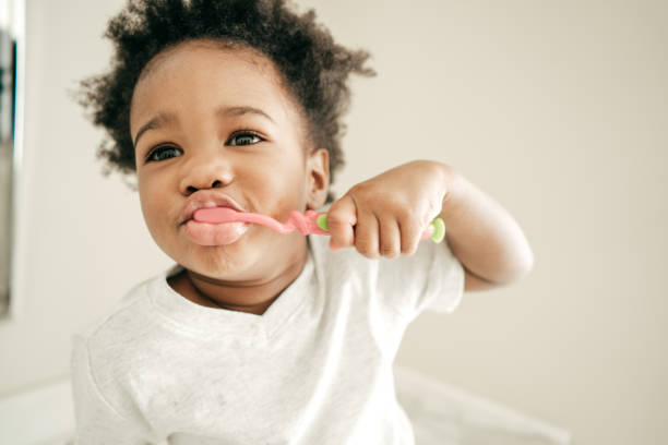 istock Toddler with toothbrush 927290382