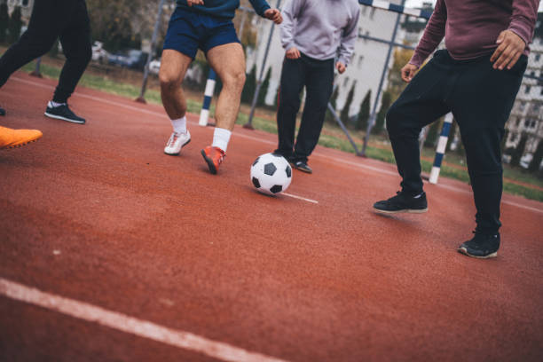 istock Friends Playing Soccer 927297234