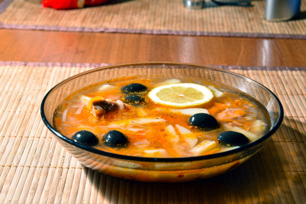 istock Fish Solyanka in a plate on a bamboo napkin 927308644