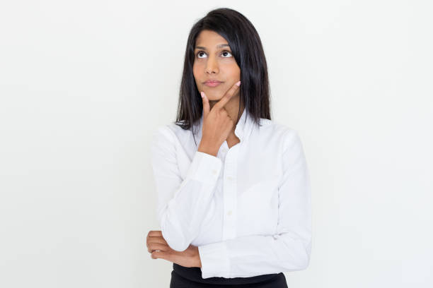 istock Pensive Attractive Young Woman Touching Chin 927309378