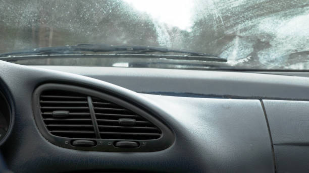 istock Closeup view air vent nozzle on car dashboard while driving 927312676