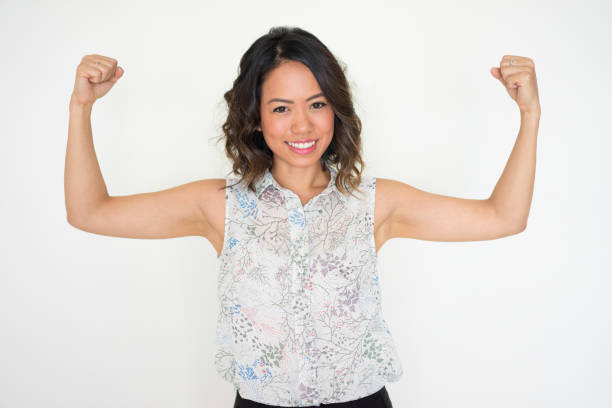 istock Cheerful cool Asian girl showing her power 927313504