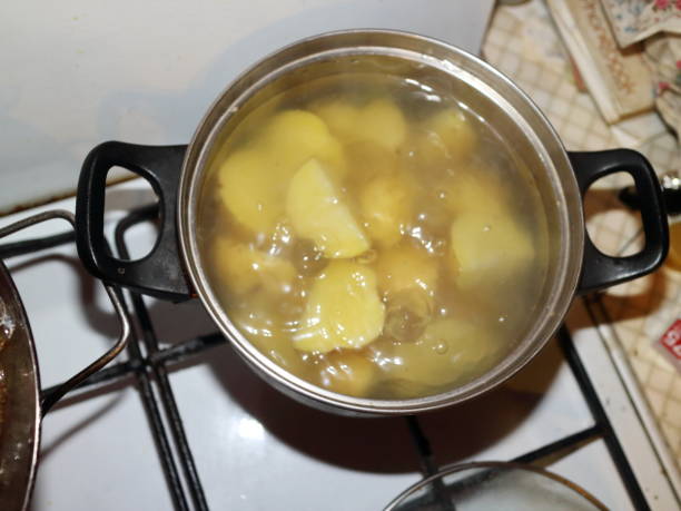 istock potatoes are cooked in a saucepan on the stove 927315754