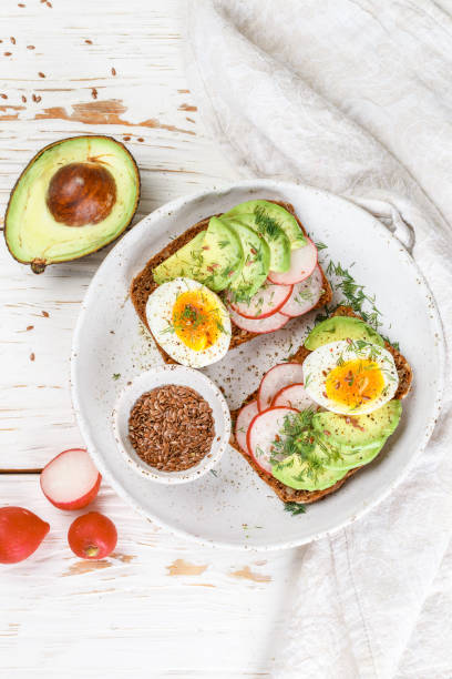 istock Toast with avocado, radish, egg and flax seeds 927316820
