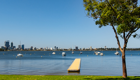 Scenic view across Swan river to Perth City.  A beautiful sunny day on the first day of autumn.