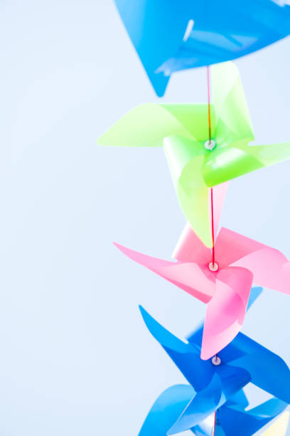 istock Toy windmill, childhood background. 927328472