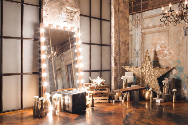istock Loft interior with mirror, candles, brick wall, large window, living room, coffee table in modern design 927336510