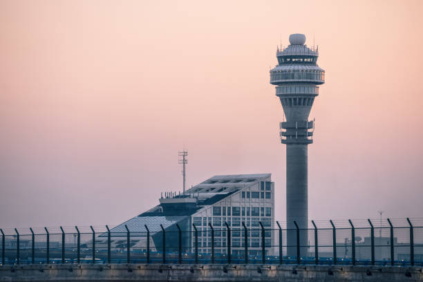 istock view of airport control tower in sunset 927343564