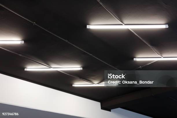 Led Tube Lights On Black Office Ceiling Minimal Loft Design Stock Photo - Download Image Now