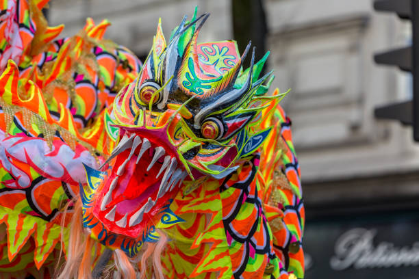 Paris,France-February 25,2018: Detail of the traditional Chinese Dragon performing in the street during the 2018 Chinese New Year parade in Paris.