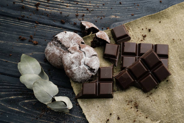 istock Chocolate cookies and chocolate on wooden table and textile 927350974