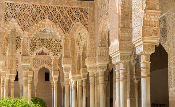 ornate walls and pillars in Alhambra Spain stock photo