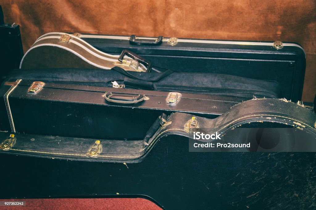 Hard Cases for guitars Are At The Wall A few Hard Cases for guitars Are At The Wall Guitar Case Stock Photo