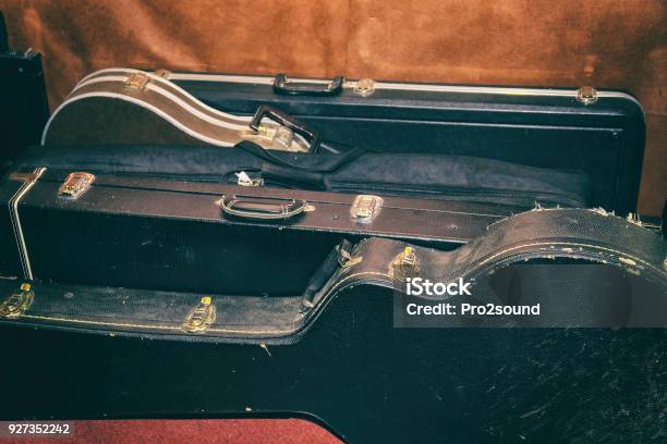 Hard Cases For Guitars Are At The Wall Stock Photo - Download Image Now - Guitar Case, Guitar, Old