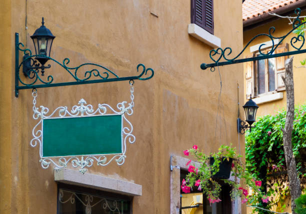 istock Vintage empty green hanging signboard. 927352386
