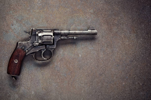 Old revolver on a dark background.