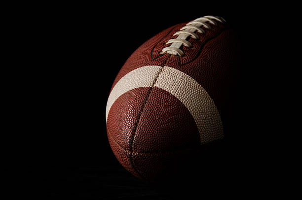 American Football Laces Up close-up on black background