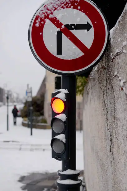 snow traffic light sign no turning right