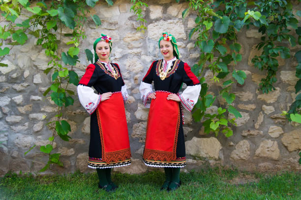 istock Folklore. Beautiful young people in folk costumes. 927368532