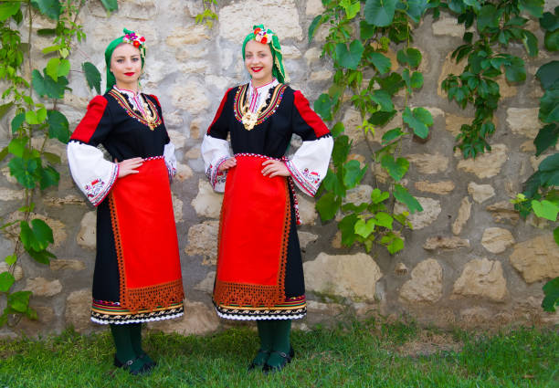 istock Folklore. Beautiful young people in folk costumes. 927368726