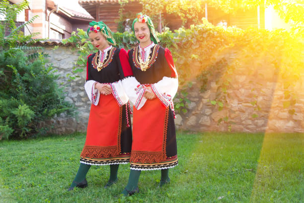 istock Folklore. Beautiful young people in folk costumes. 927369874