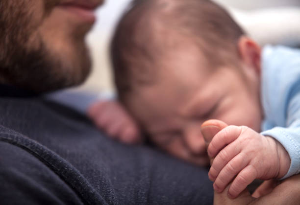 istock Father with his newborn baby 927371198