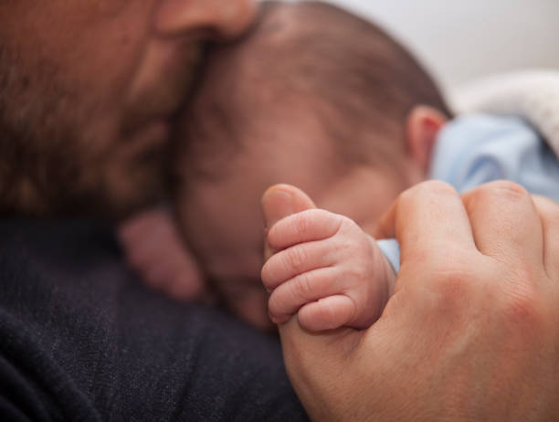 istock Father with his newborn baby 927371220