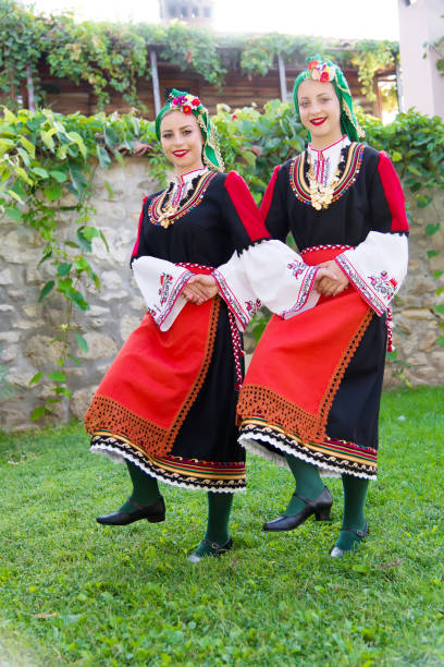 istock Folklore. Beautiful young people in folk costumes. 927372106