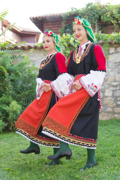 istock Folklore. Beautiful young people in folk costumes. 927372440