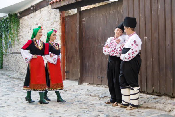 istock Folklore. Beautiful young people in folk costumes. 927374734